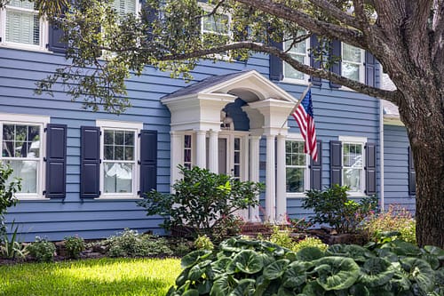 Classic Colonial Home Features Colonial-style home showing symmetrical windows with shutters, centered front door, and side-gabled roof