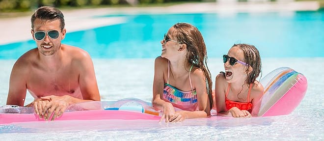 happy-family-three-outdoors-sw Lorraine Lakes community pool